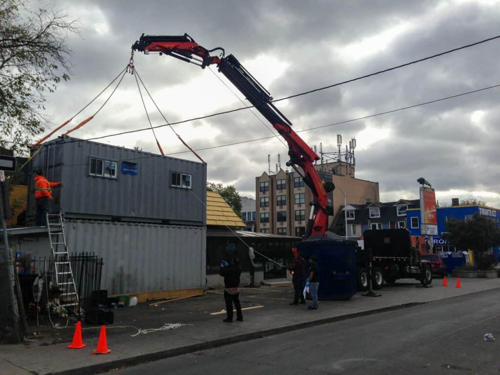 Stacking 20' containers with crane